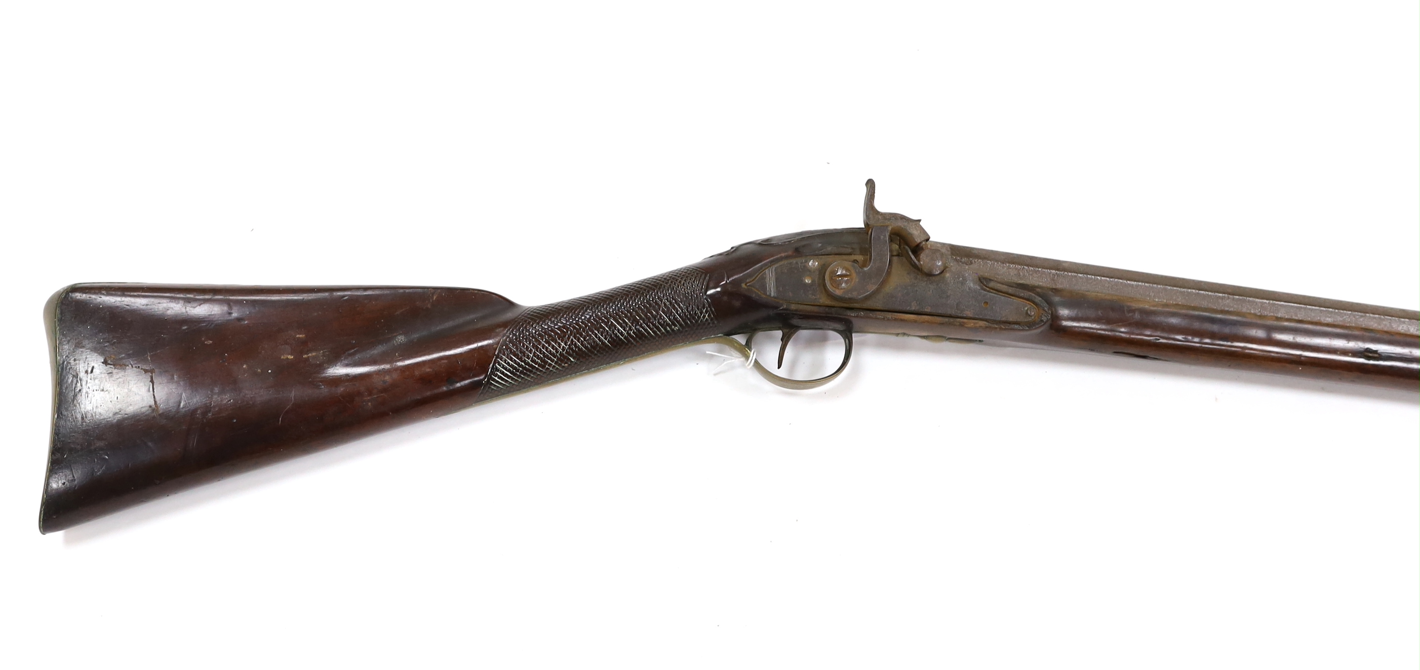 A 1786 percussion 12 bore fowling piece, converted from flintlock, with a fully stocked half octagonal barrel, London proofs, brass furniture and sideplate engraved IR 1786, chequered grip and wooden ramrod, barrel 96cm
